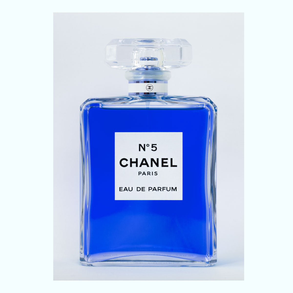 no5 bottle with blue perfume